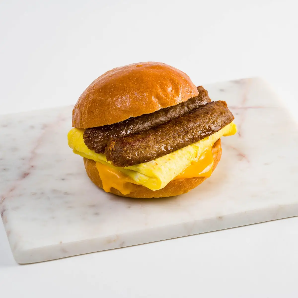 Sausage Egg Cheddar on Brioche