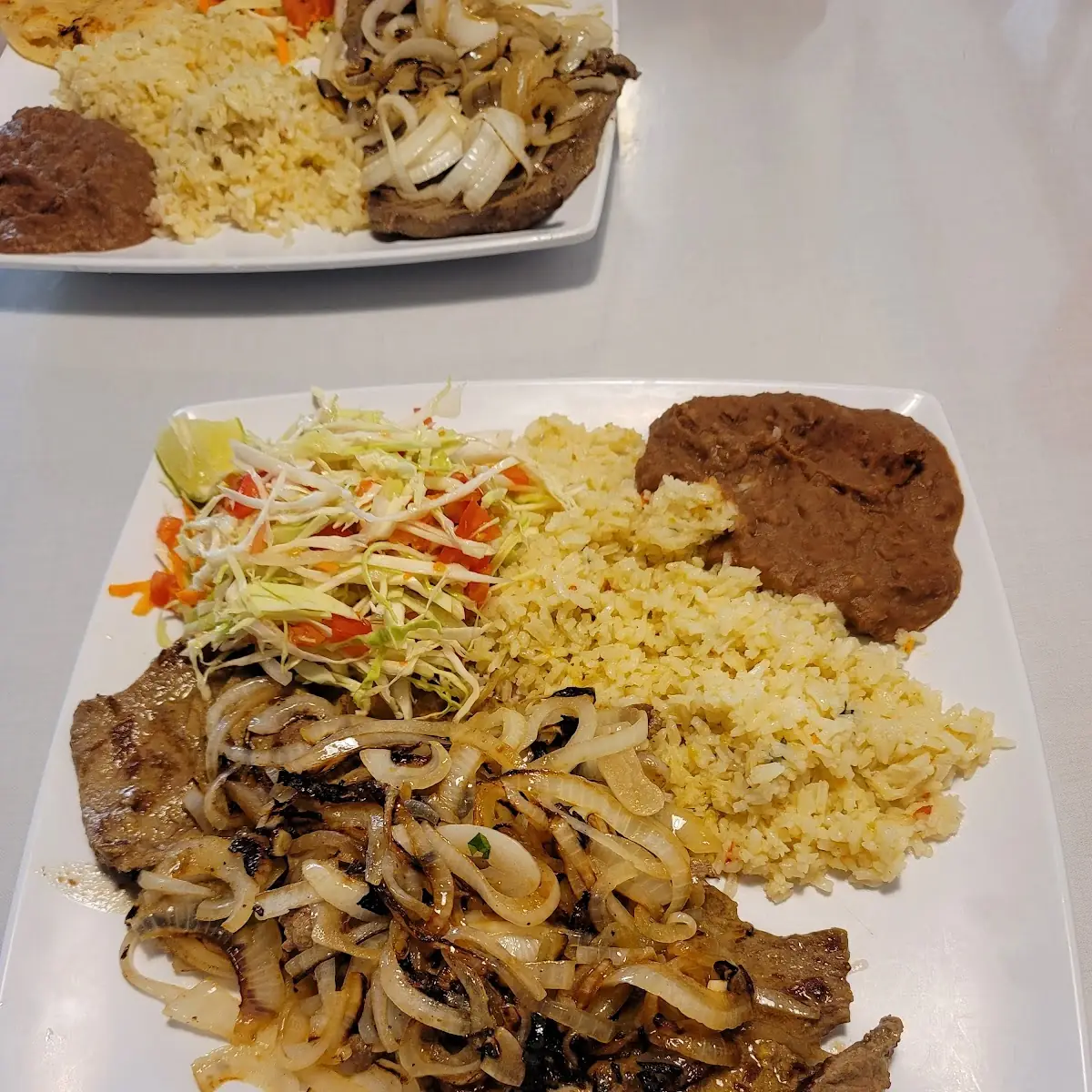 Bistec Encebollado 8 Steak with Onions