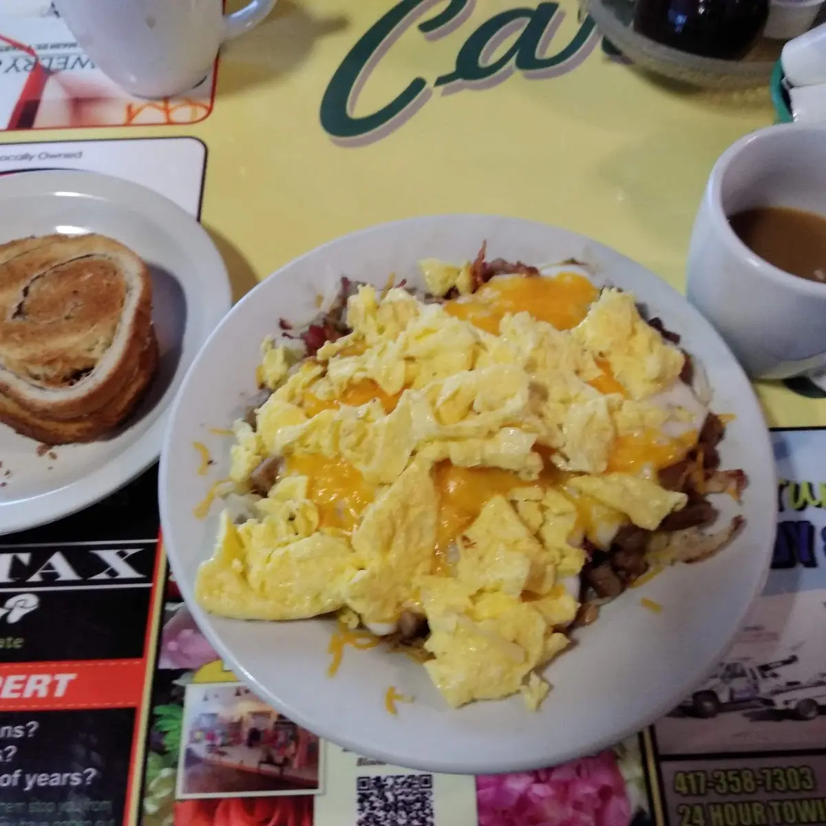 Scrambled Eggs with Cheddar over Corned Beef Hash & Cinnamon Toast