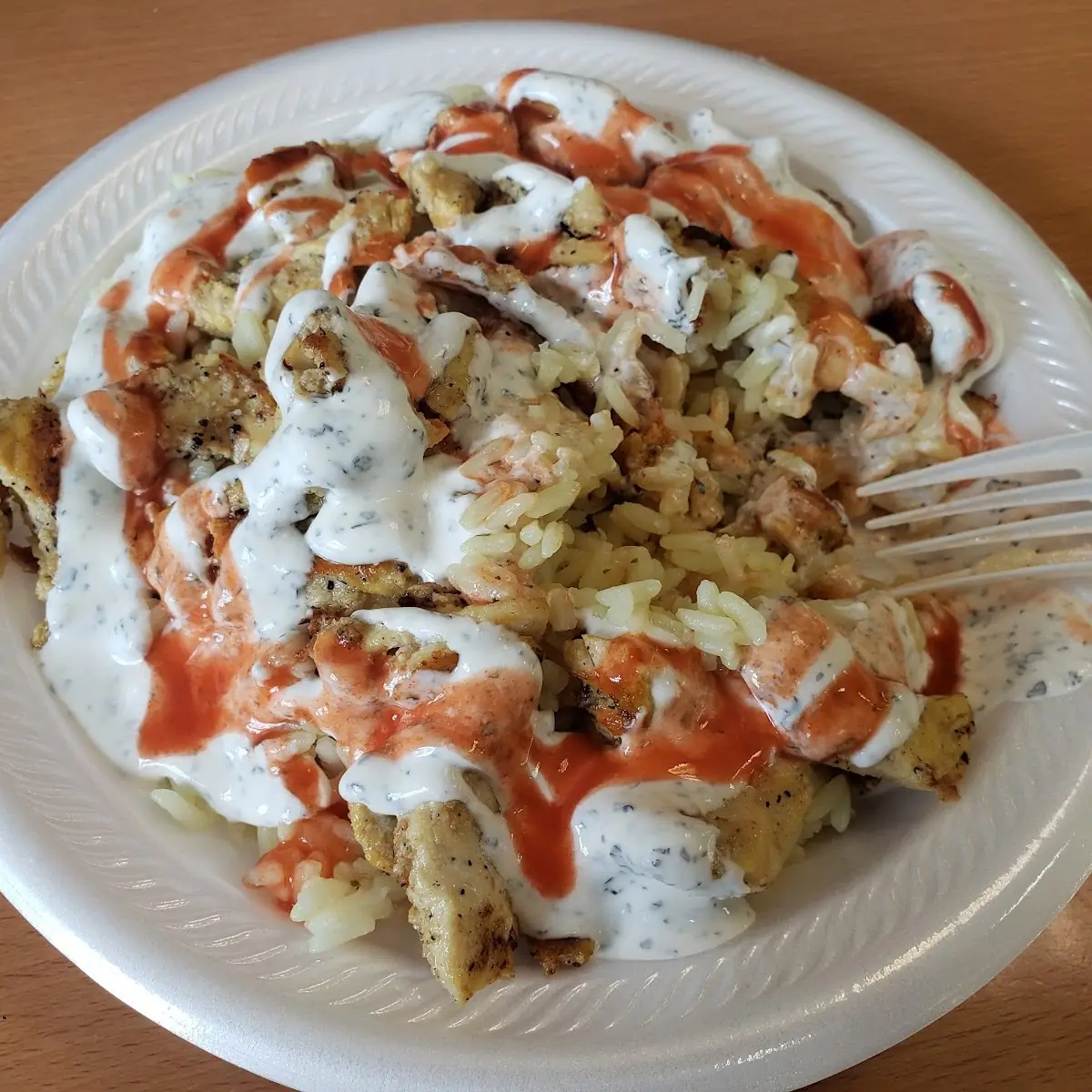 Chicken over Rice with Hot Sauce and White Sauce