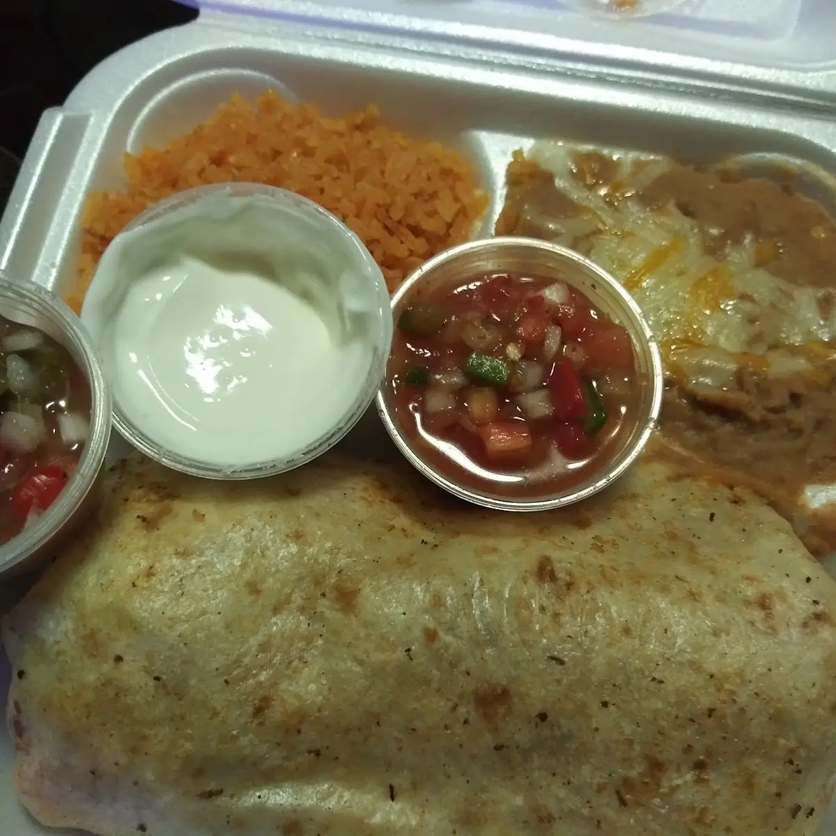 Ground Beef Stuffed Burrito with Refried Beans and Cheese with Spanish Rice