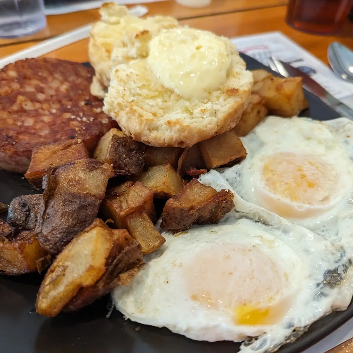 Corned Beef Hash with Eggs over Medium and Home Fries