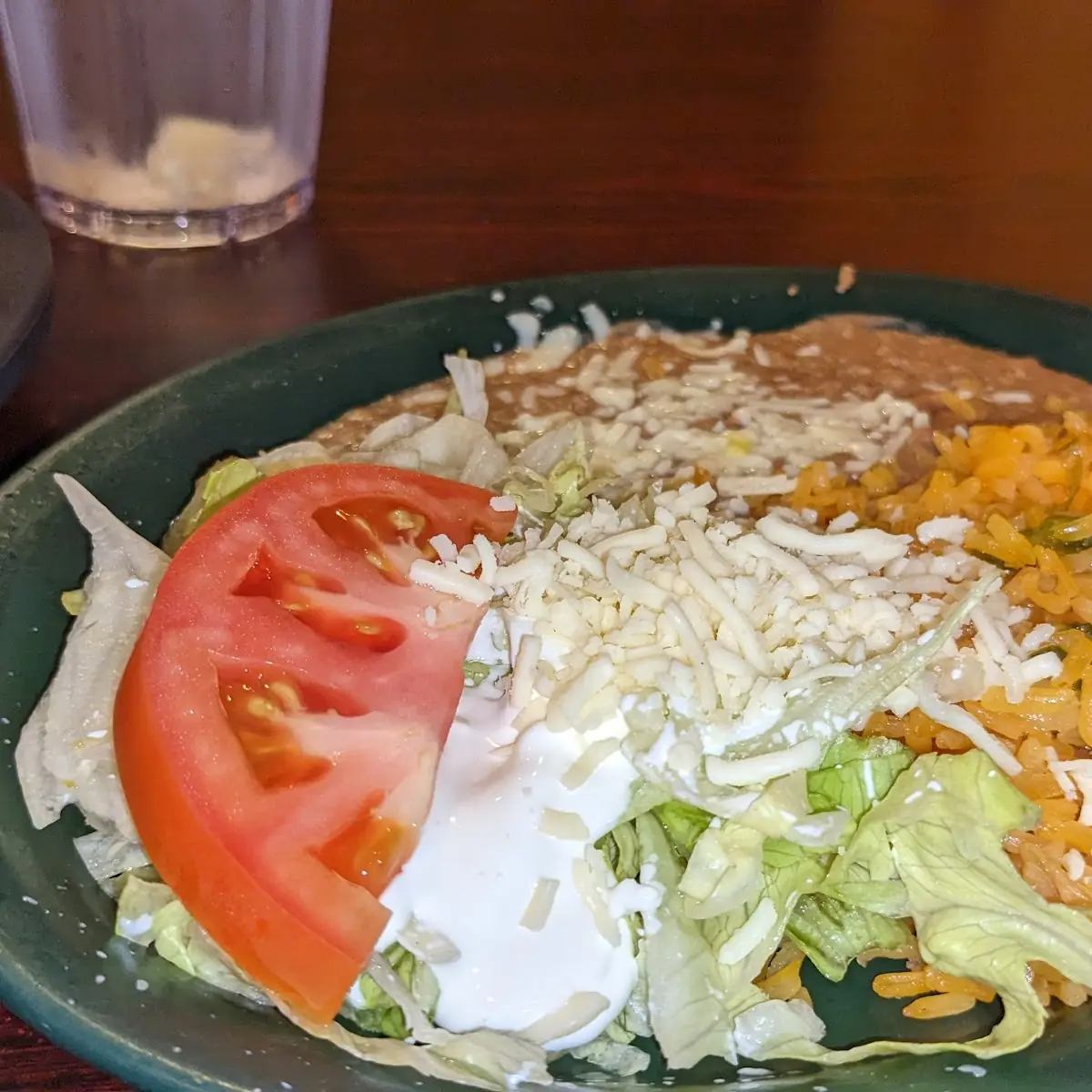 Refried Beans Sour Cream Lettuce and Tomatoes
