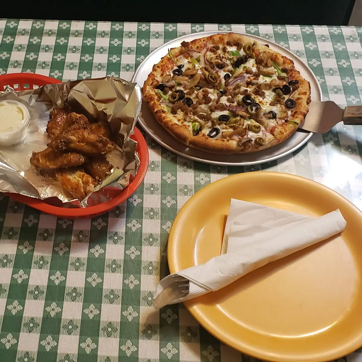 Veggie Pizza with Beef Bits Alongside Chicken Wings