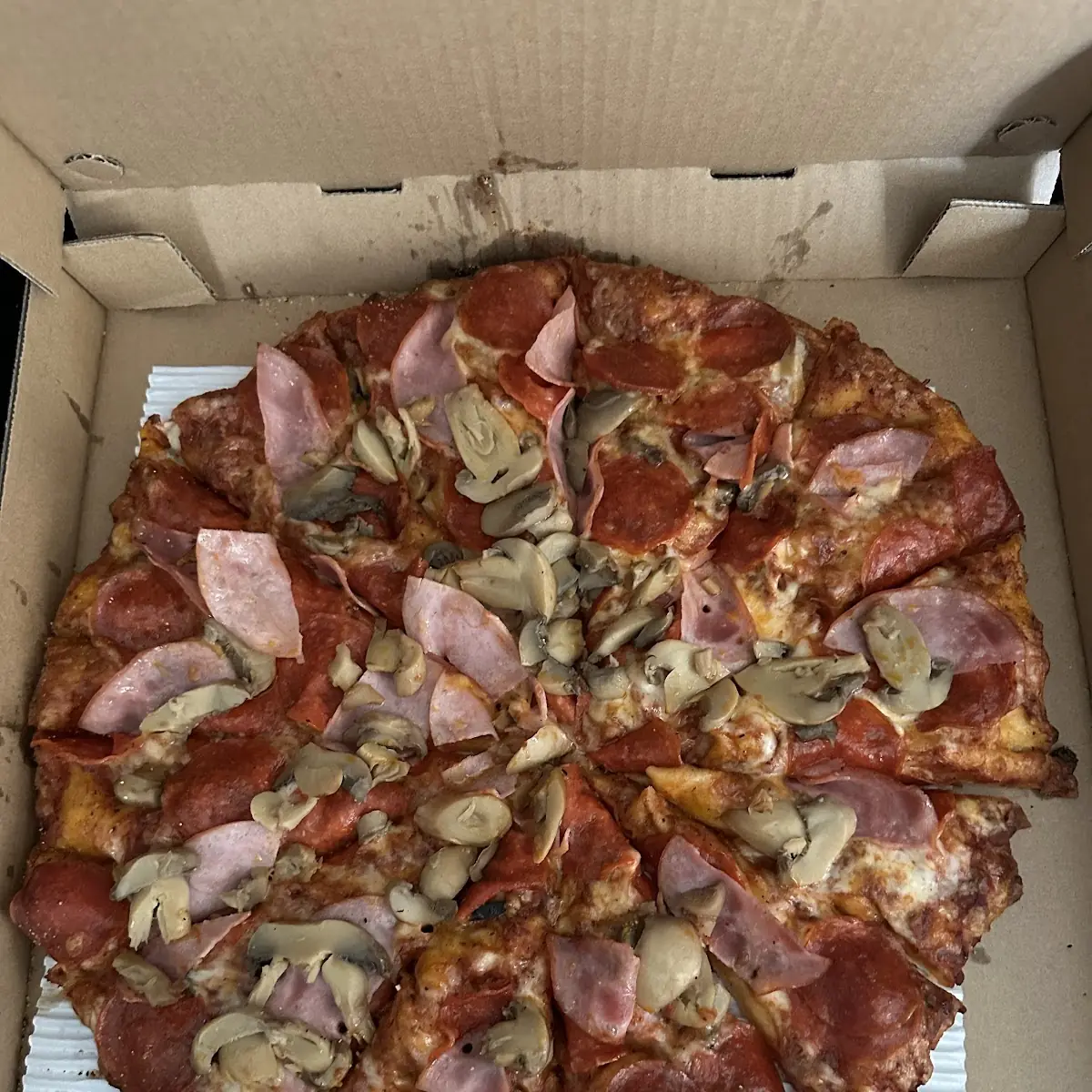 Pepperoni Canadian Bacon and Mushroom Pizza