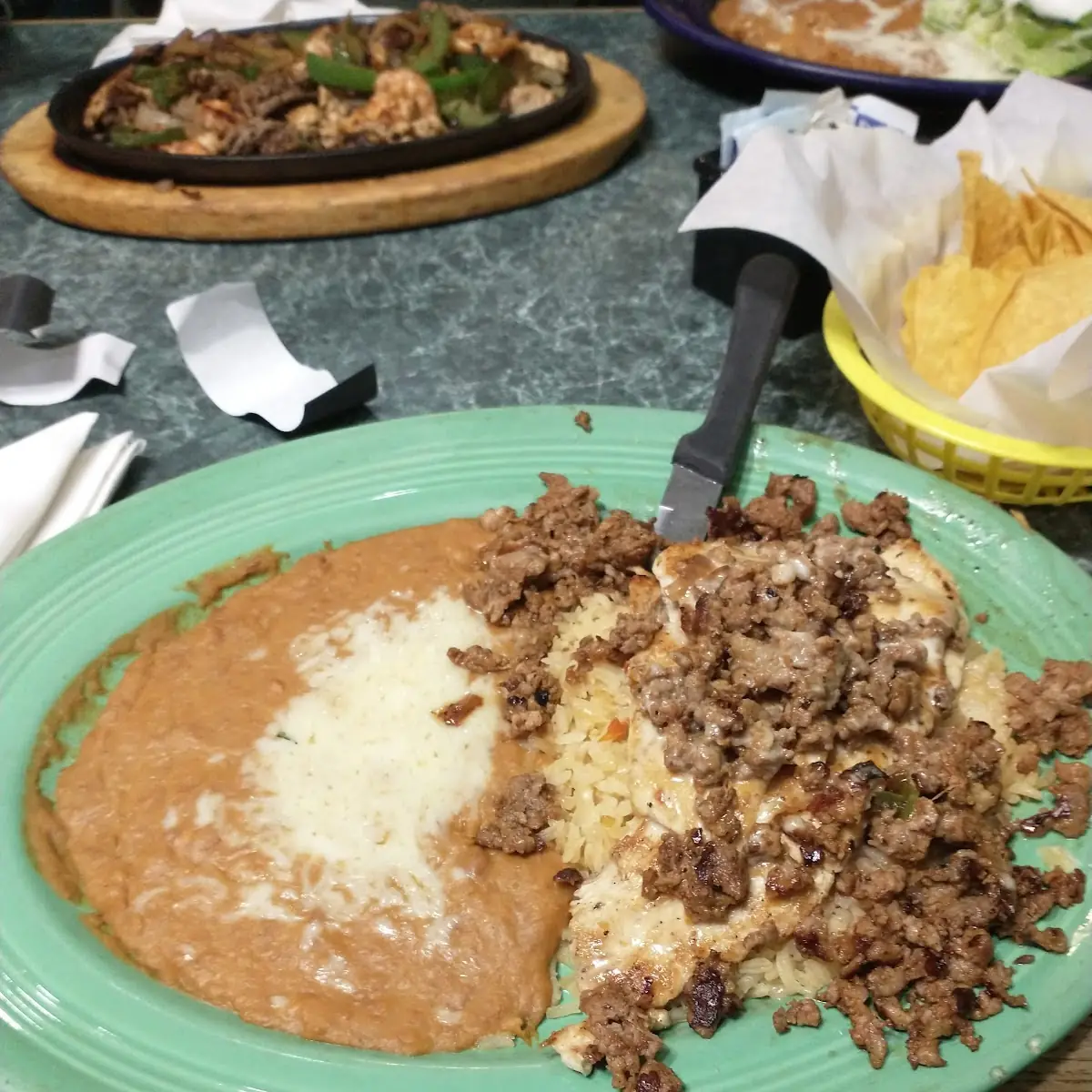 One Tostaguac One Burrito & Refried Beans