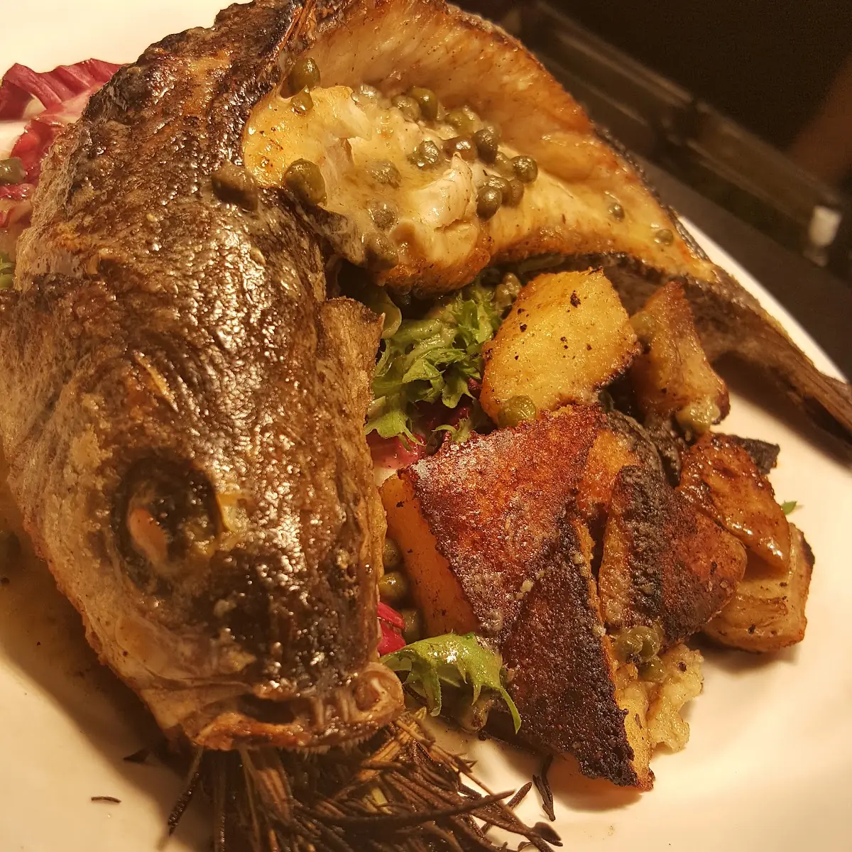Brick Oven Roasted Whole Branzino Lemon-Caper Vinaigrette Artichoke Polenta