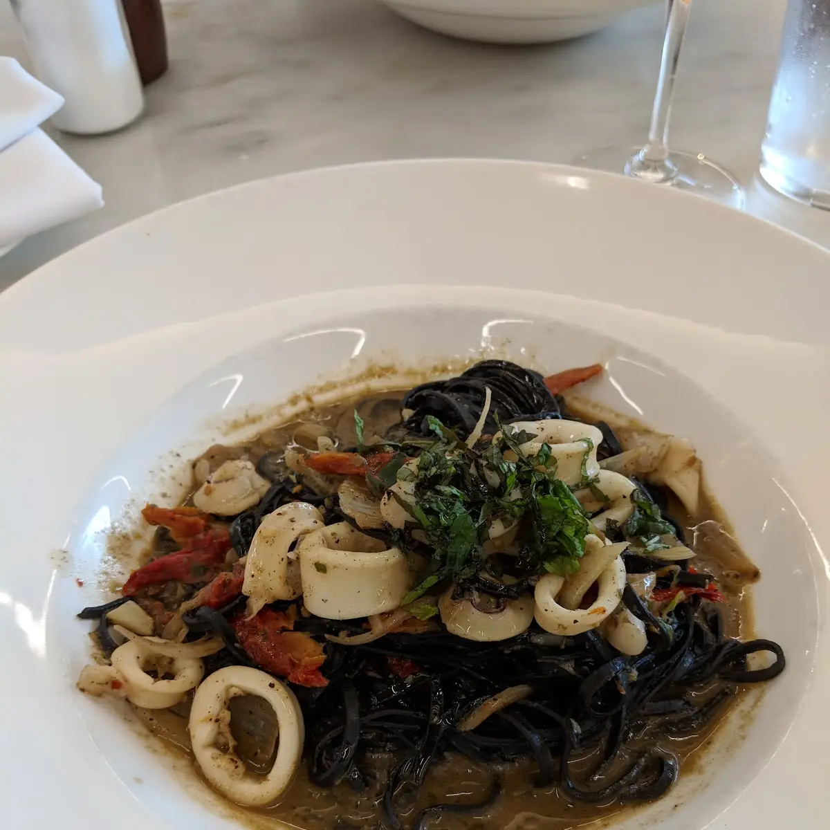 Squid Ink Linguine Calamari Calabrain Chiles Anchovy Sofrito Meyer Lemon Oil Mint Sun-Dried Tomatoes