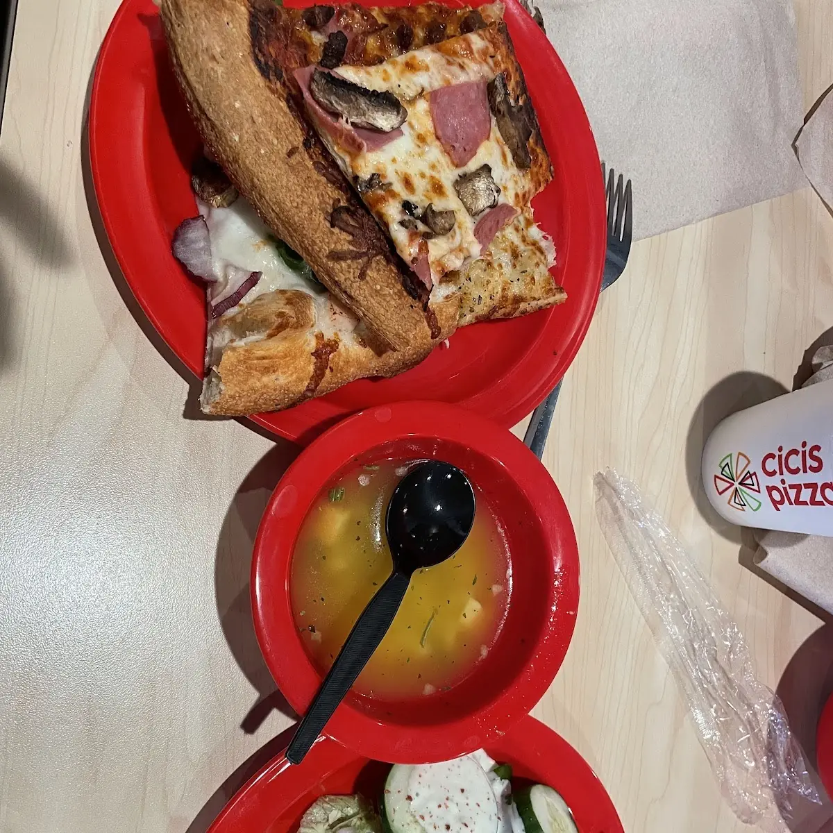 Pizzas Salad and Chicken Noodle Soup