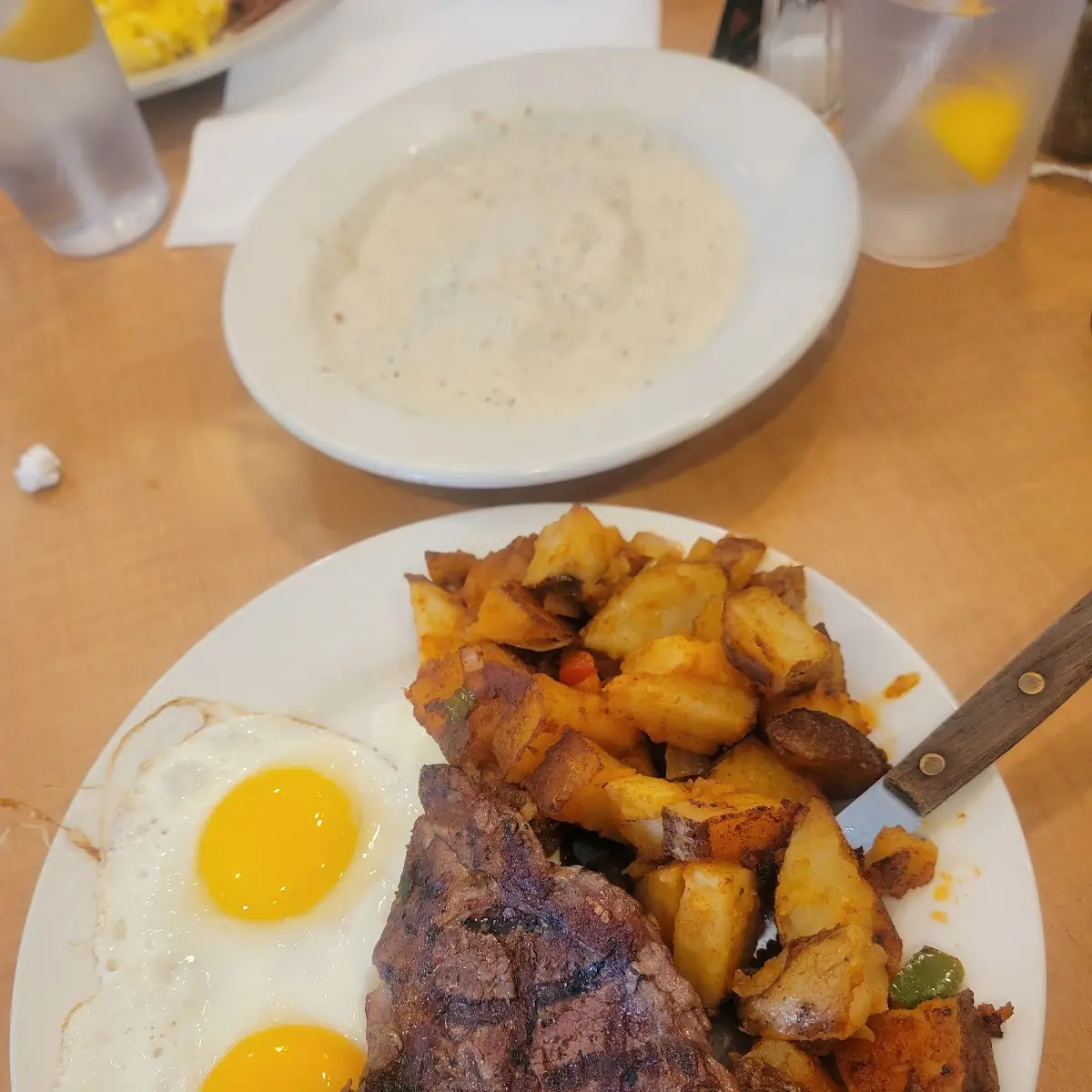 Steak and Eggs Home Fries Biscuits and Gravey