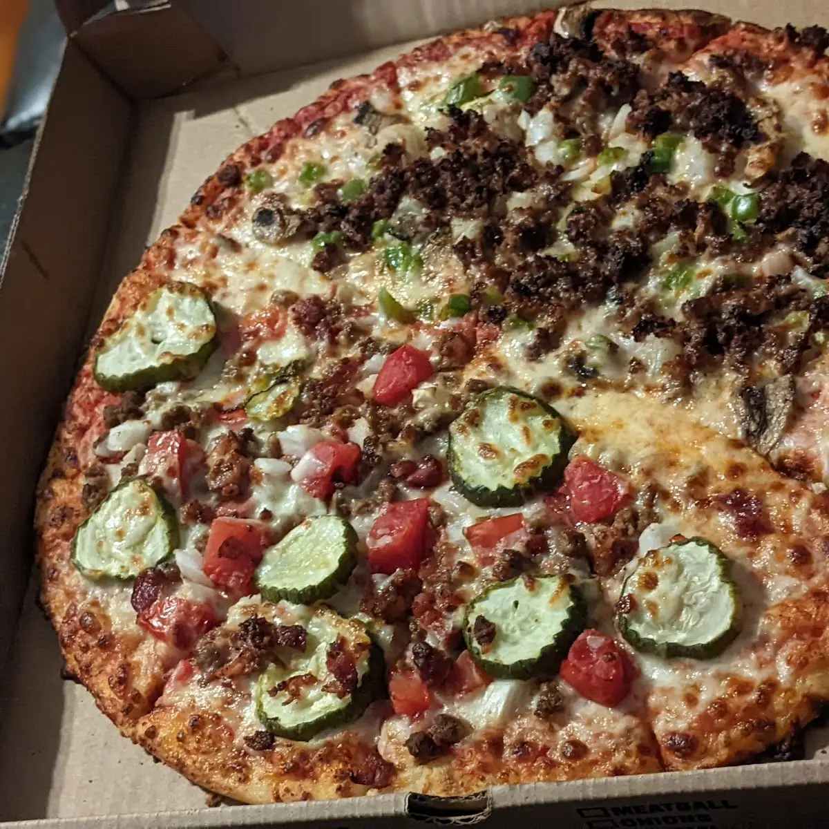 Half Cheeseburger and Half Philly Cheesesteak Pizza