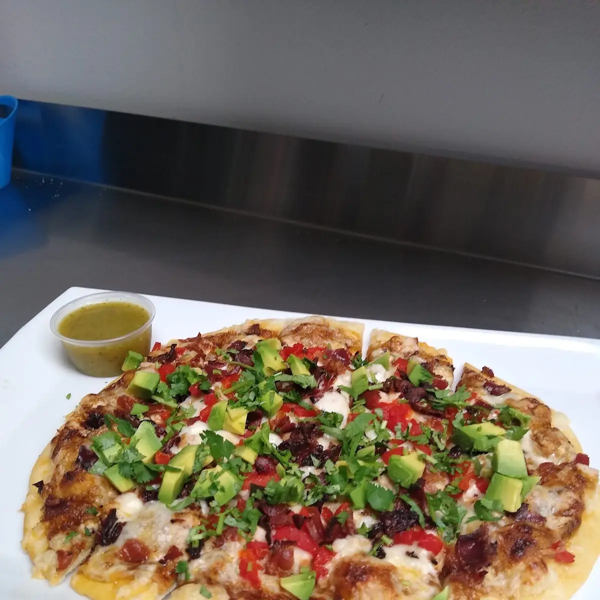 Flat Bread with Chicken Avocado Chipotle Sauce Bacon and Cilantro