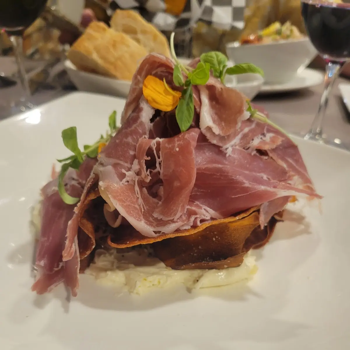 Prosciutto over Sweet Potato Chips and Everything Cremé