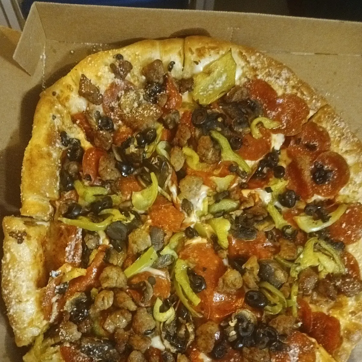 Create Your Own Pizza Crazy Stuff Crust Pizza with Peperoni Sausage Bell Peppers and Balck Olives