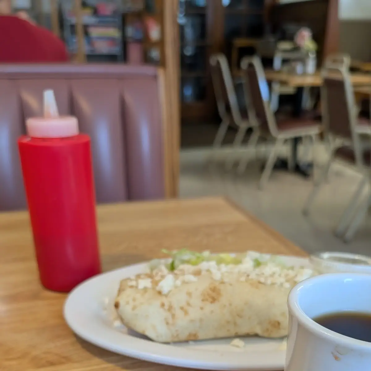 Cinnamon Nut Roll in Foreground w Al Pastor Burrito