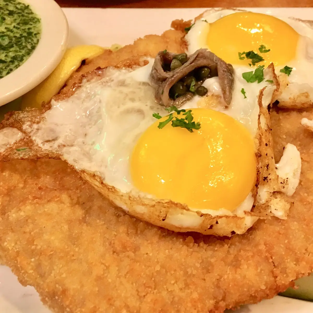 Wiener Schnitzel Split into 2 Portions with Red Cabbage as an Extra Side