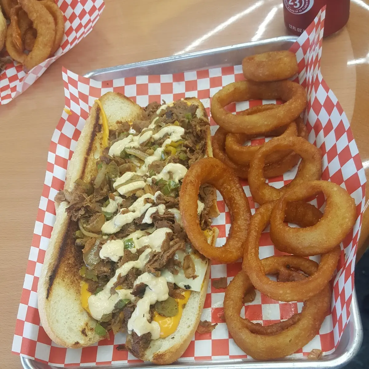 Philly Cheese Steak Sandwich and Onion Rings