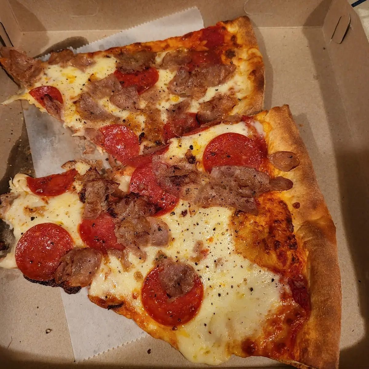Pepperoni Sausage and Extra Cheese Pizza Slice