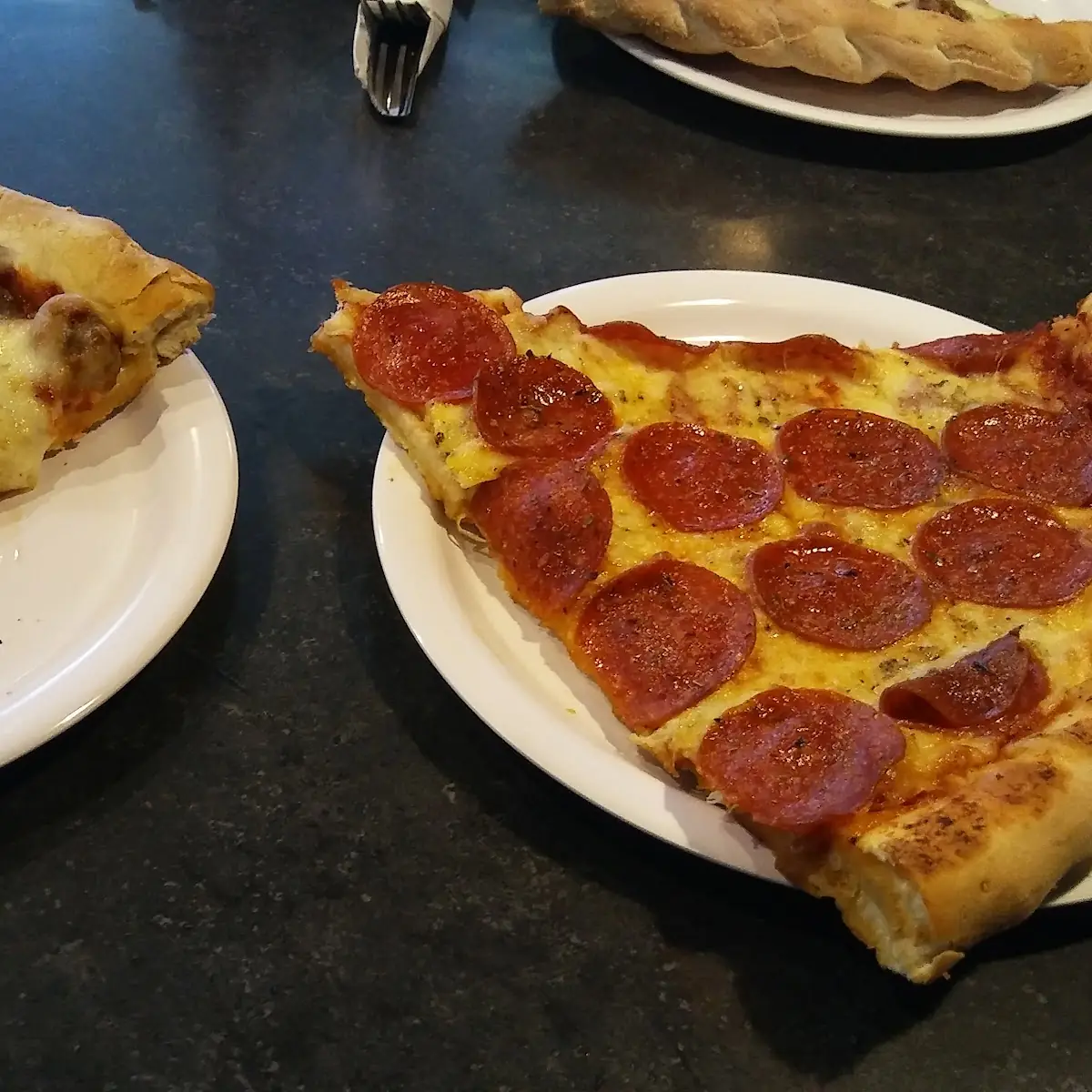 Pepperon and Sausage Pizza Slice
