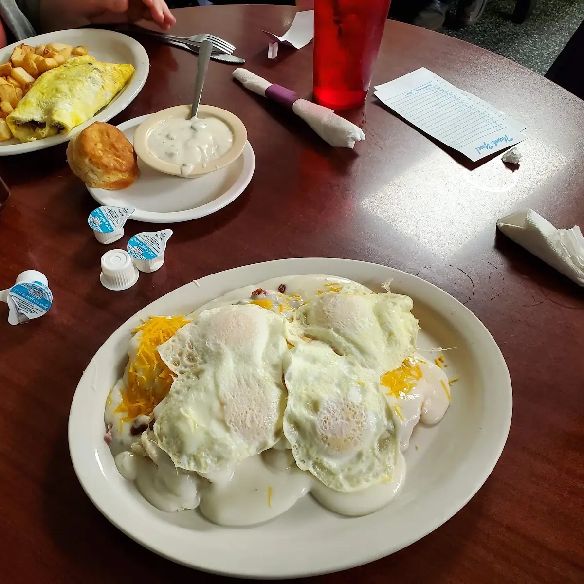 Eggs over Medium Home Fries Bacon Biscuit and Gravy