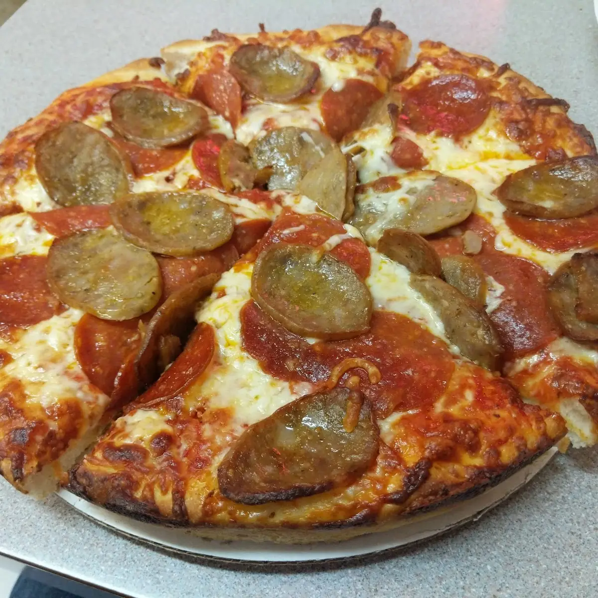 Pepperoni and Sausage Pizza Slice