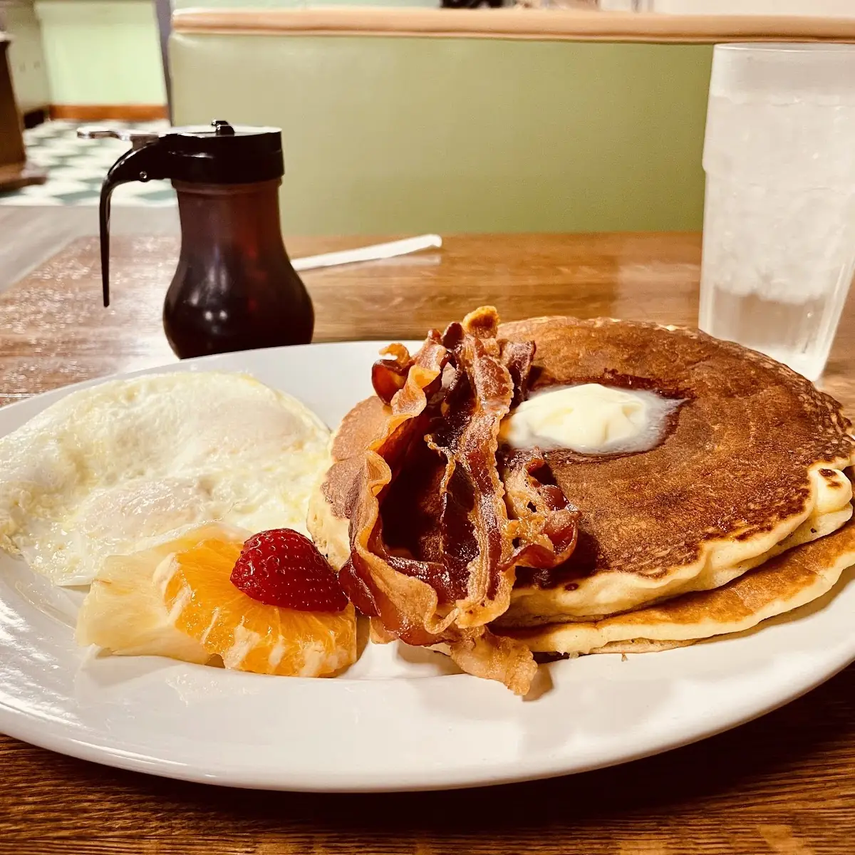 Cakes and Eggs with Bacon and Fresh Fruit