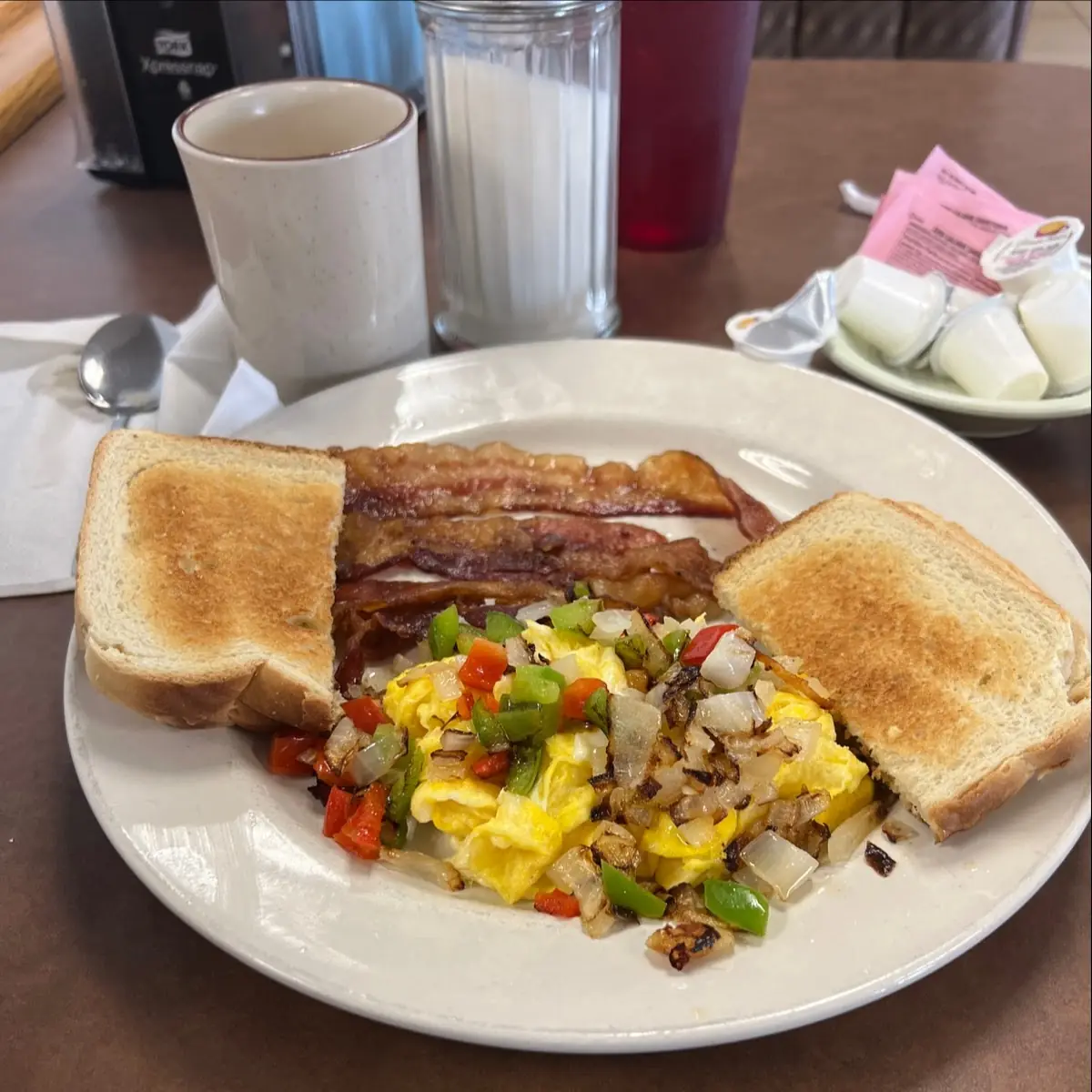 Scrambled Eggs with Onions and Peppers White Toast and Bacon