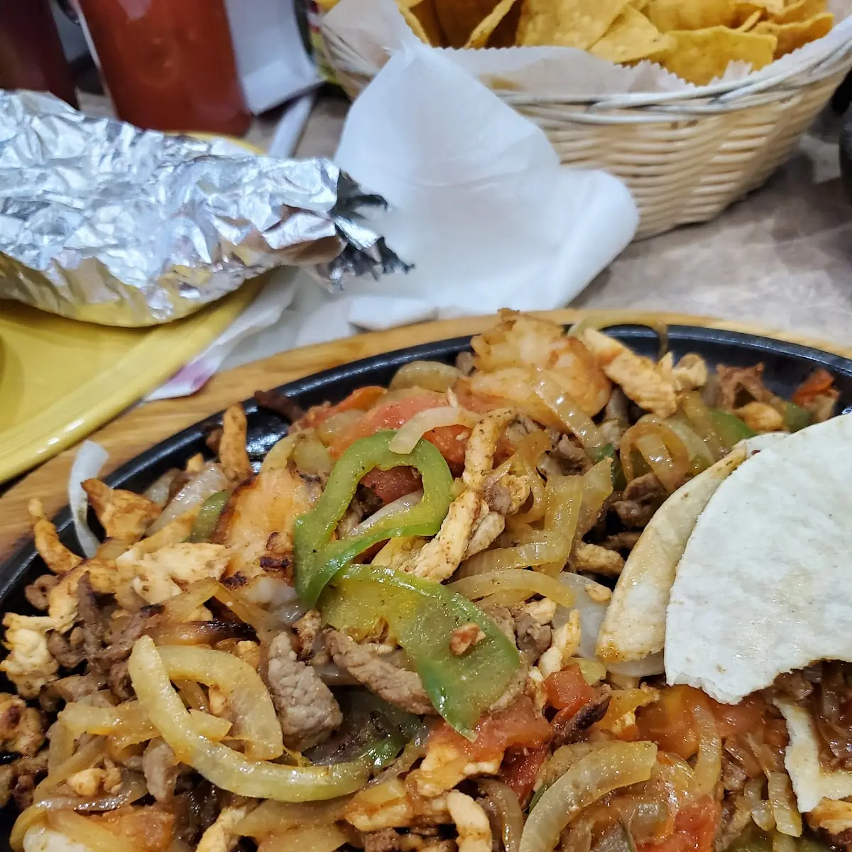 Shrimp Chicken and Steak Fajitas