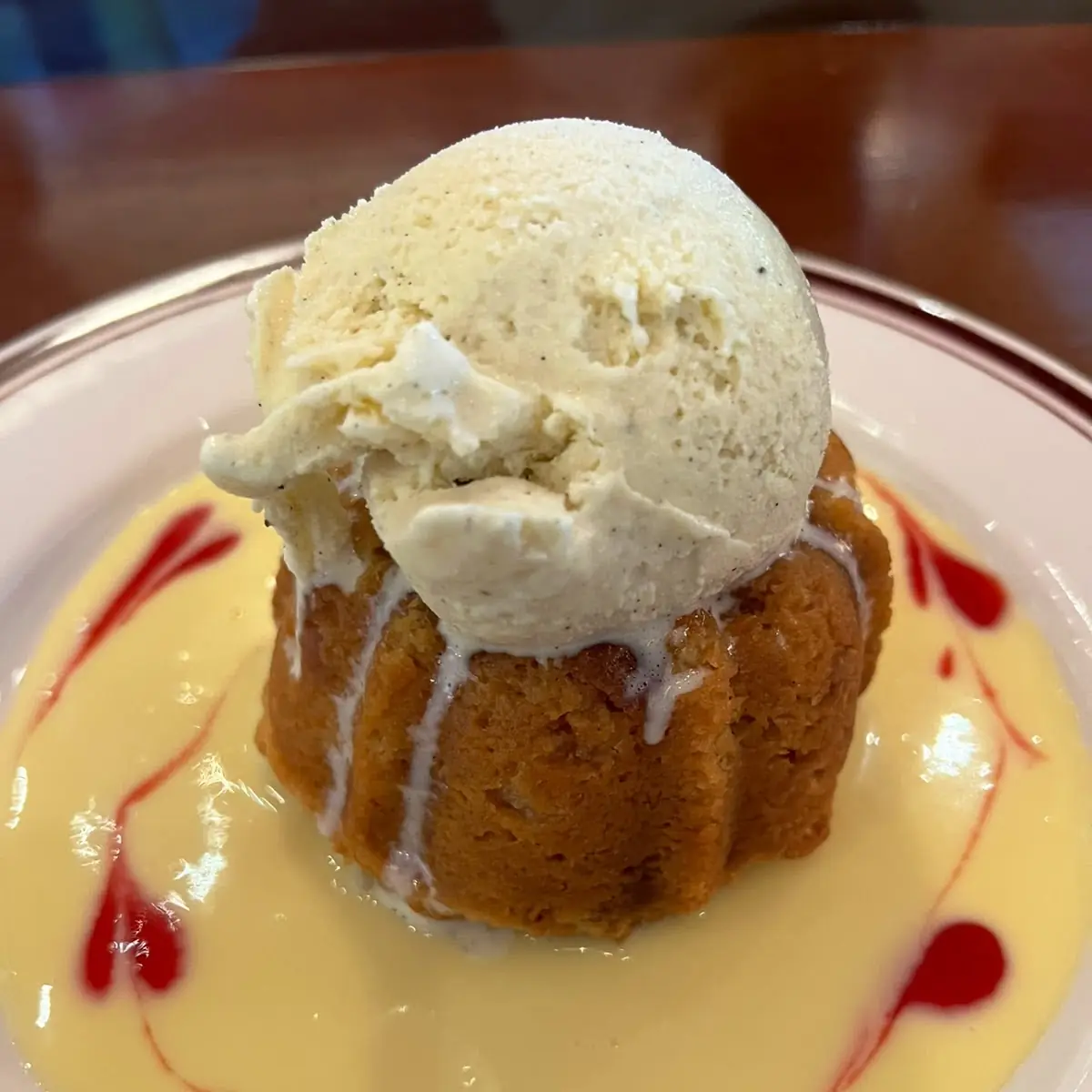 Warm White Chocolate Bread Pudding with Bourbon Custard Sauce Vanilla Ice Cream & Caramel