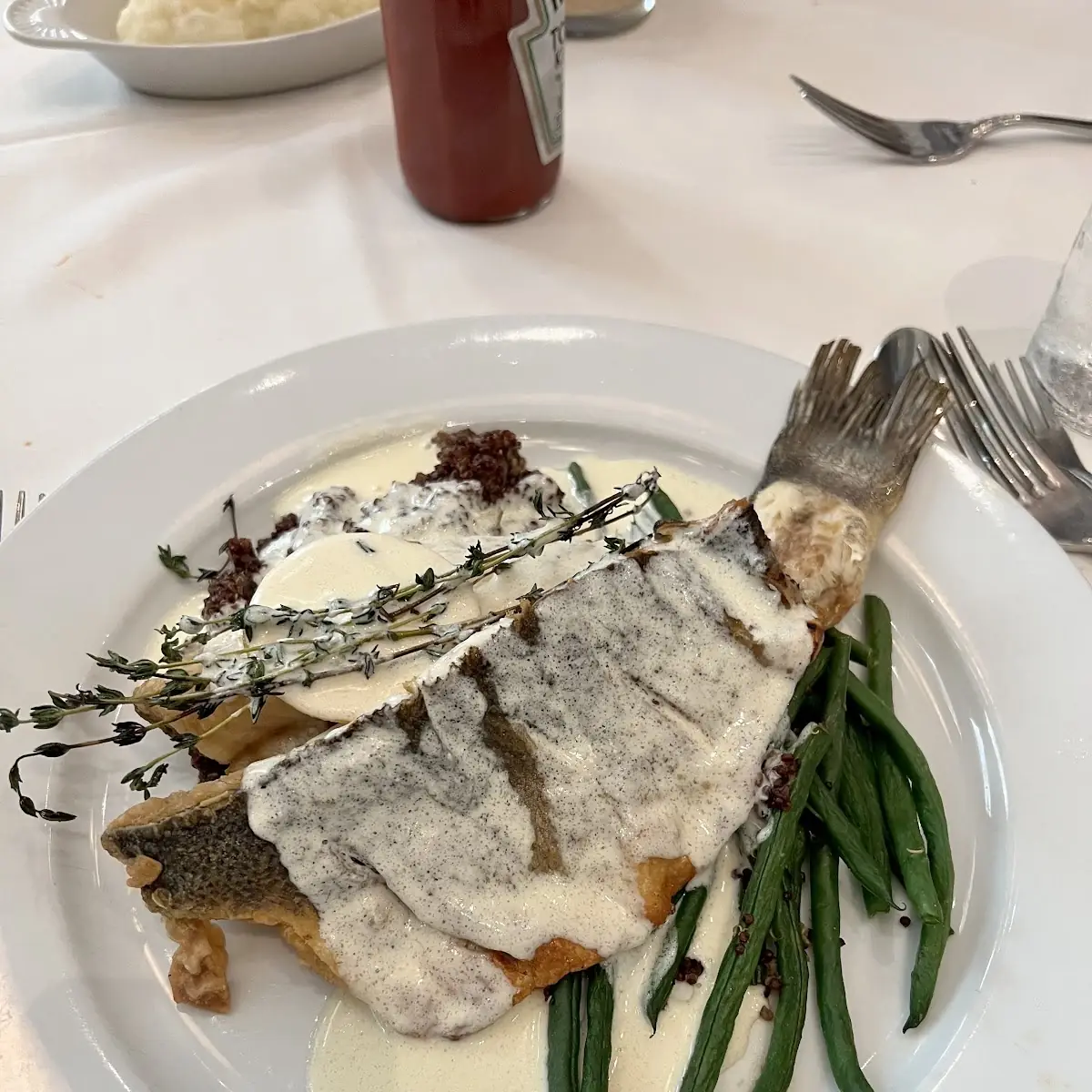 Pan Roasted Bronzino with Fresh Herbs Quinoa Haricot Verts and Lemon Beurre Blanc