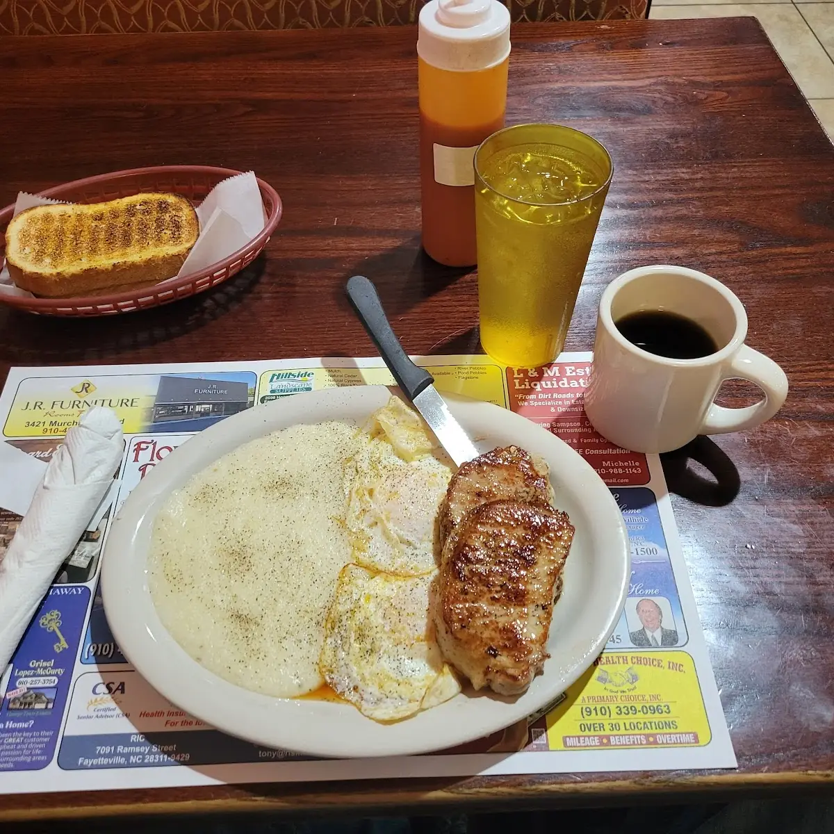 Pork Chops Eggs Grits and Rye Toast