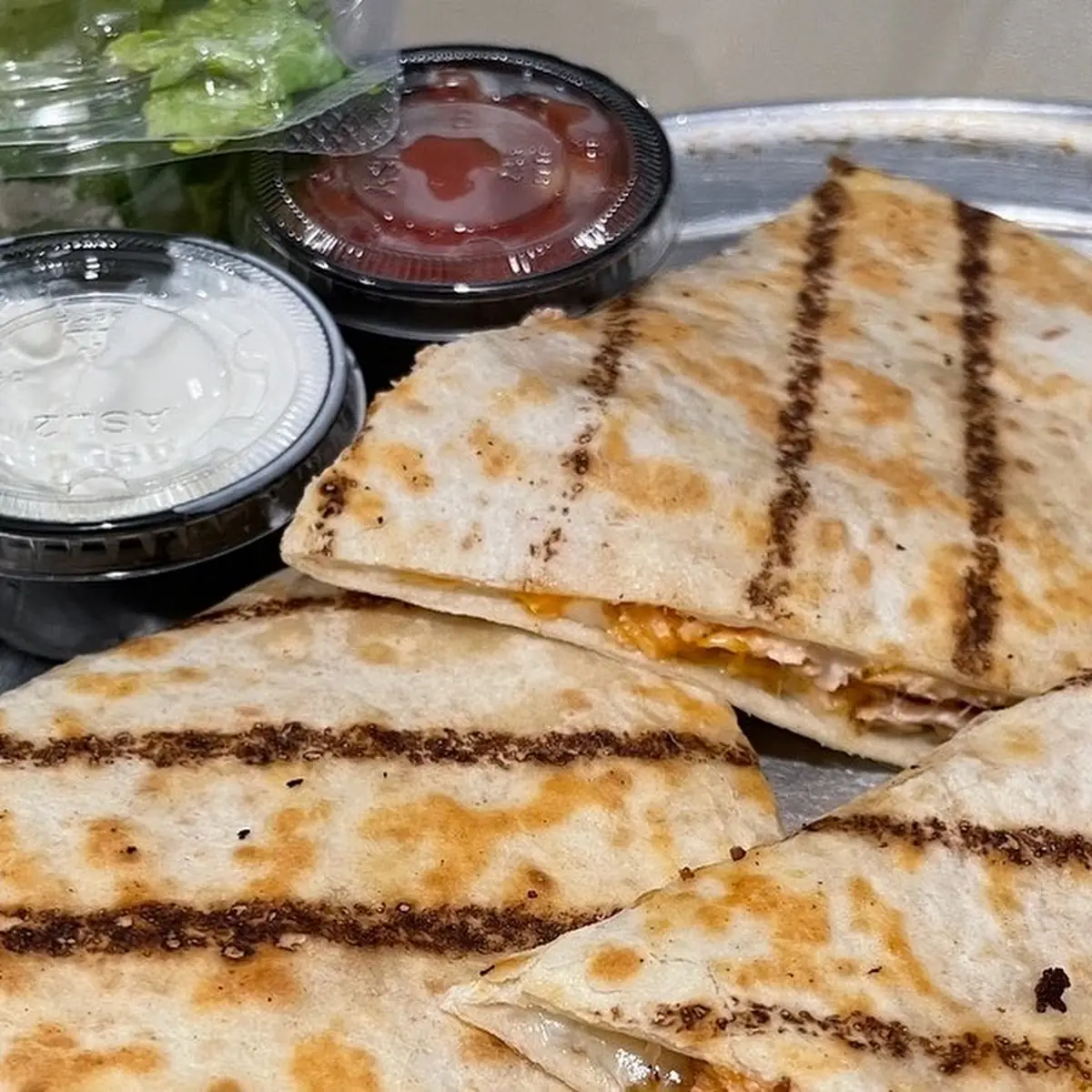 Spec Quesadilla Grilled Turkey with Salsa & Sour Cream Served with a Side Caesar