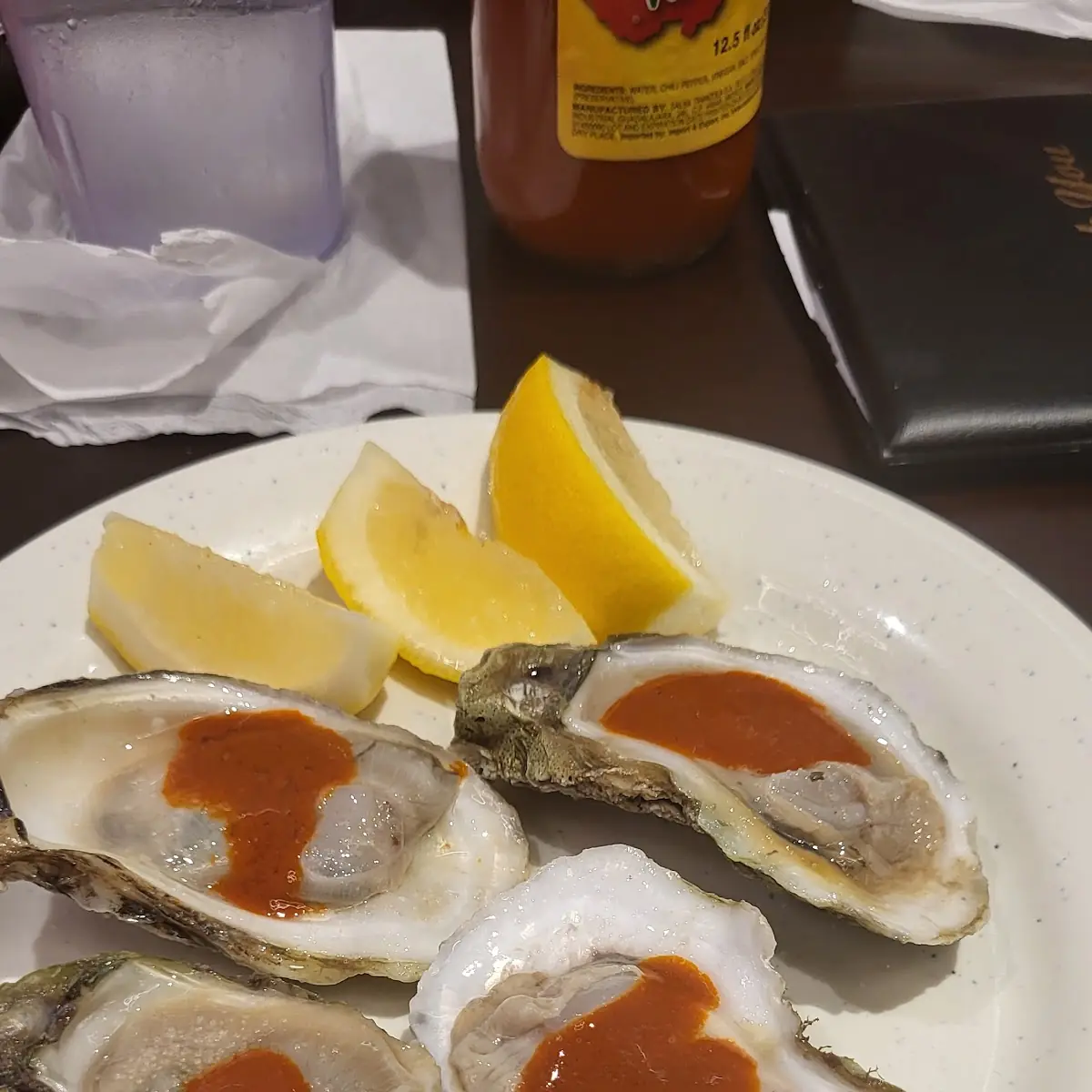 Fresh Raw Oysters with Lemon Wedges