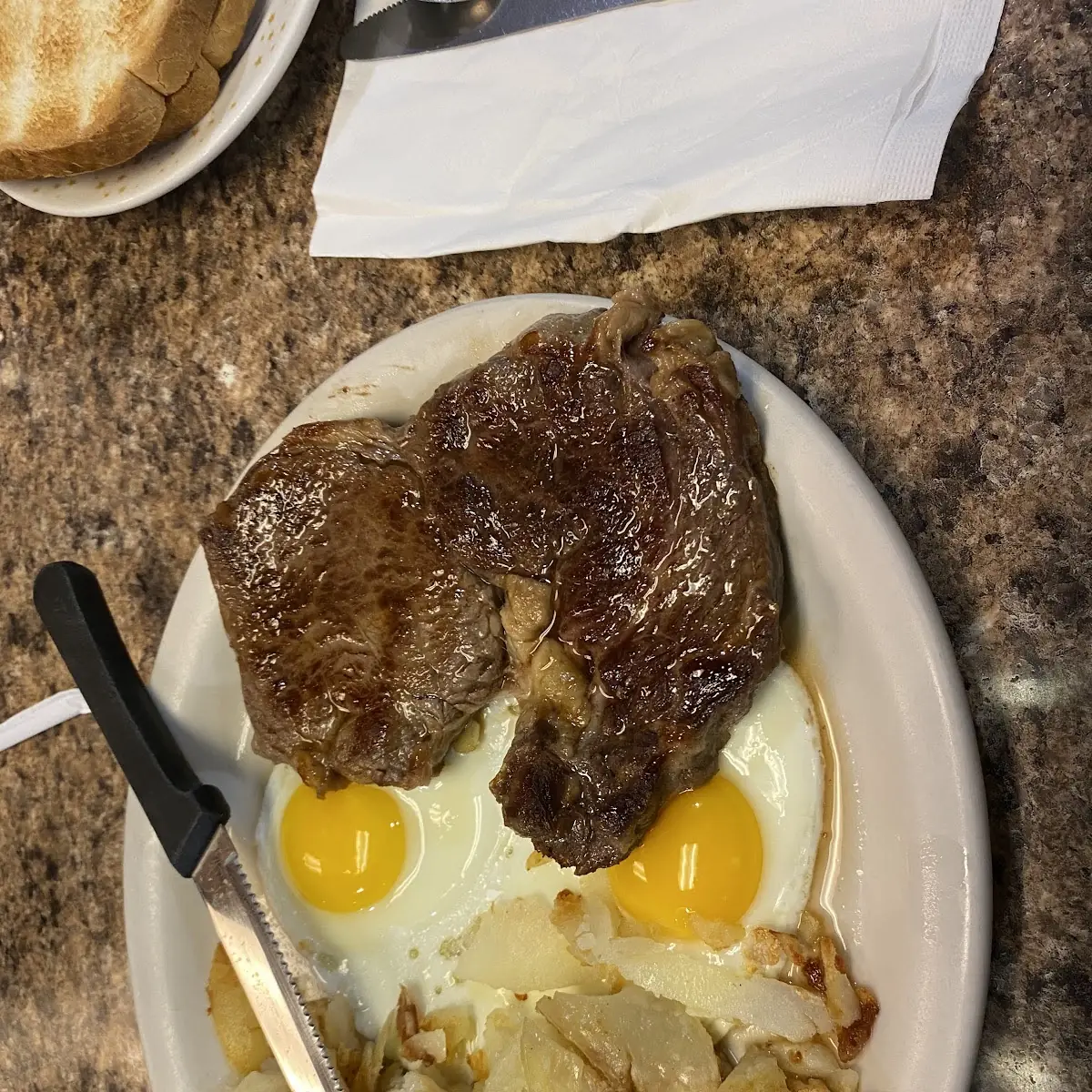 Ribeye Steak with Sunny Side Up Eggs and Hash Browns
