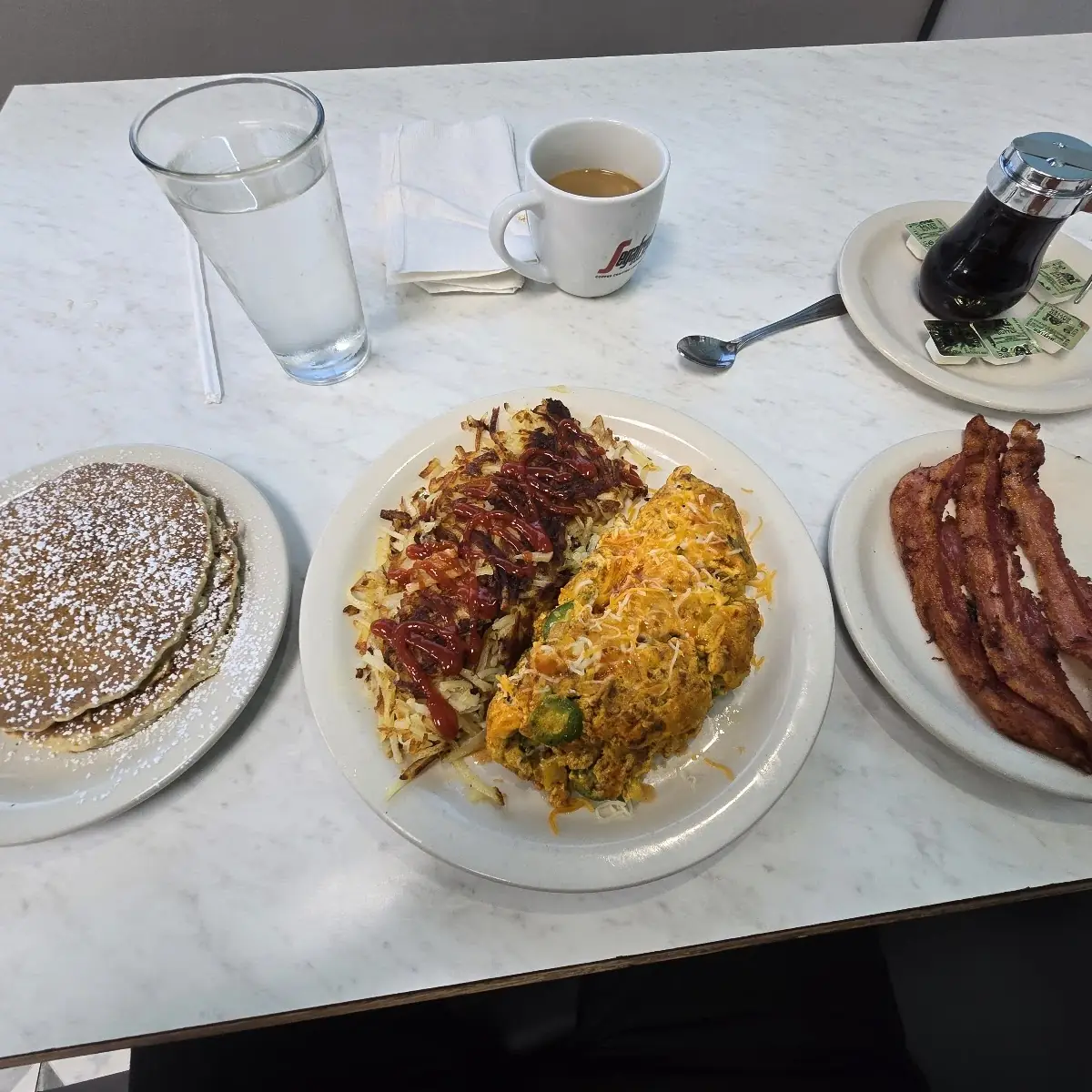 Chocolate Chip Pancakes Hashbrowns and Bacon