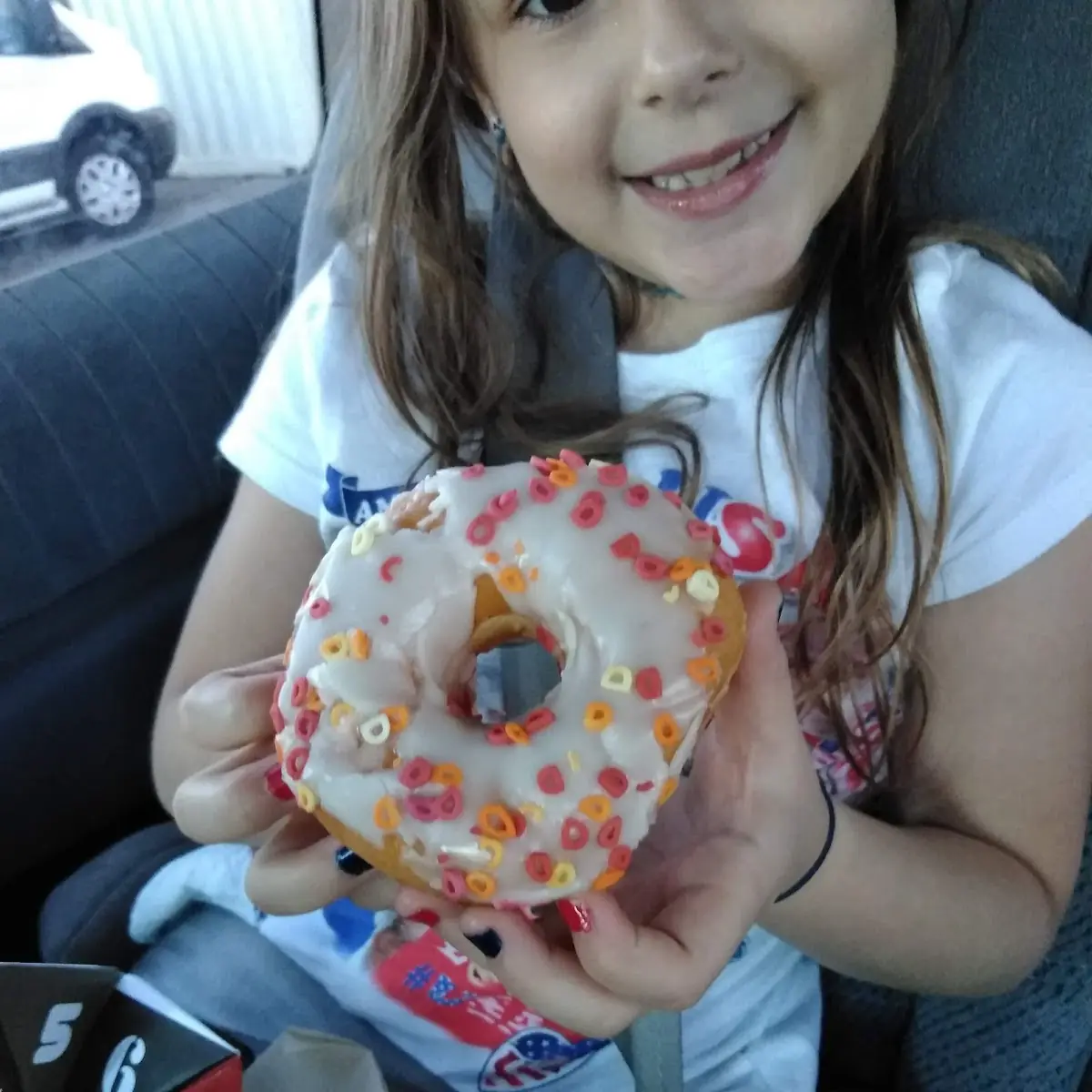 Vanilla Frosted Donut with dd Sprinkles