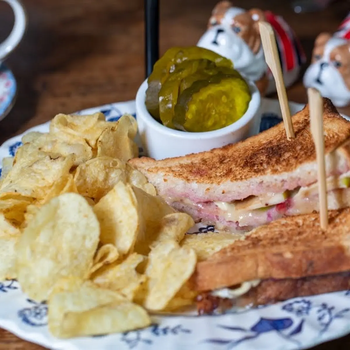 Toasted Sandwich with Chips and Pickle