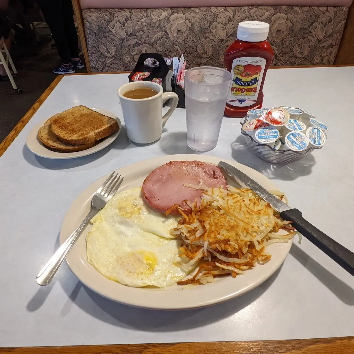 2 Medium over Eggs with Ham and Hash Browns Two Wheat Toasts and Coffee