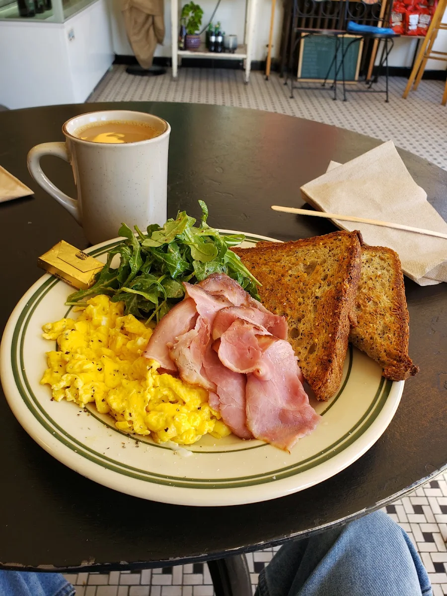 Egg Plater with Ham Some Greens with Whole Grain Bread