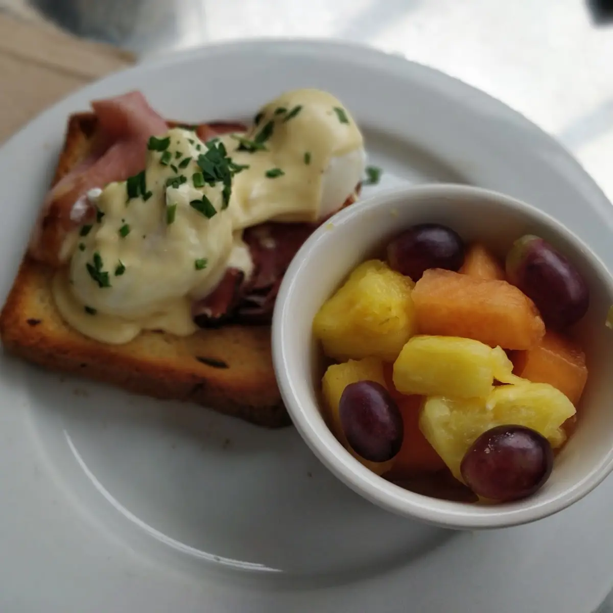 Eggs Benedict and Fruit Salad