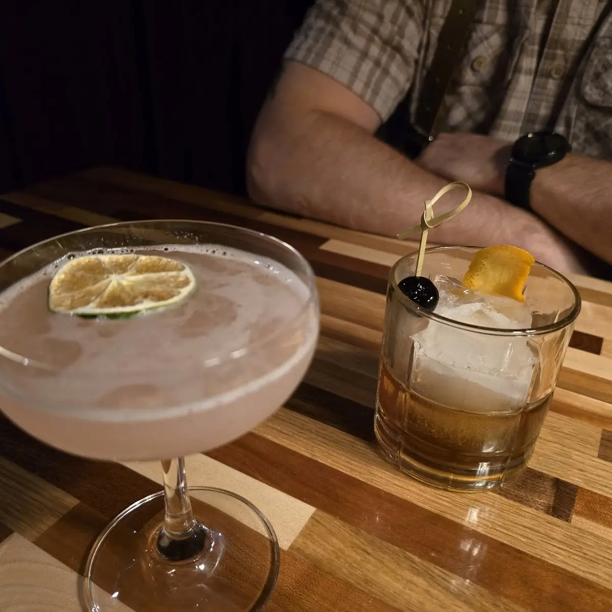 Cosmopolitan Left and Ironfish Smoked Maple Old Fashioned Right