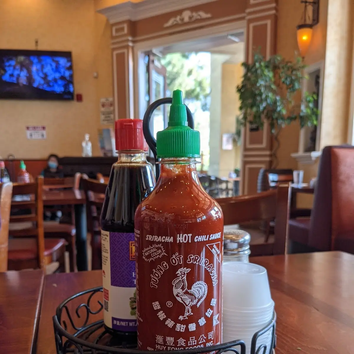 Sriracha and Hoisin Sauce on Table