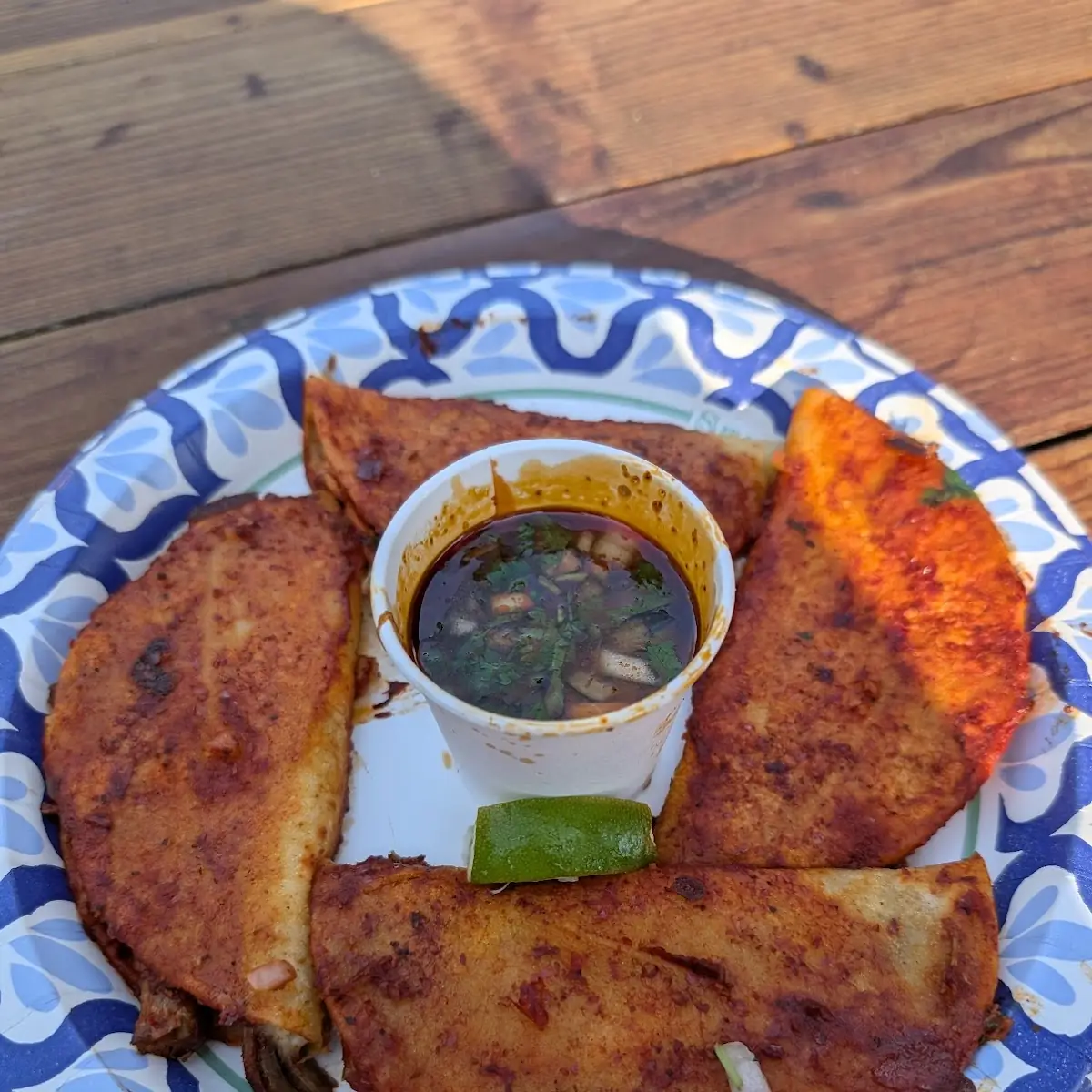 Birria Tacos with Dipping Sauce and Lime