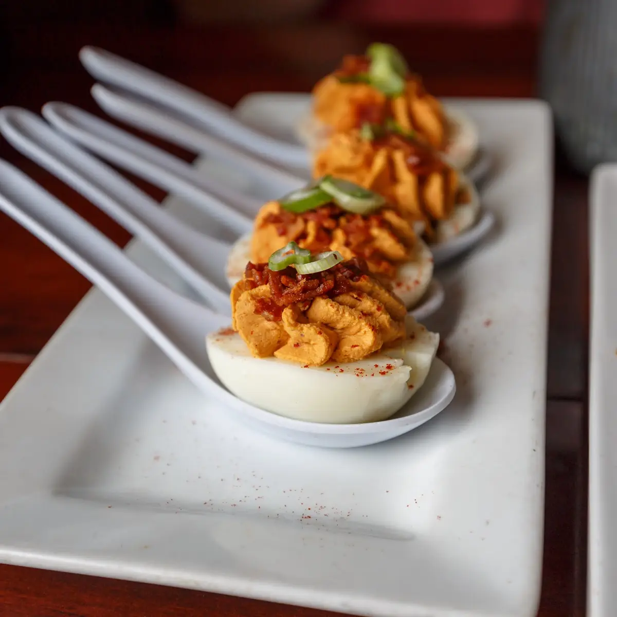 Chipotle Deviled Eggs Topped with Bacon