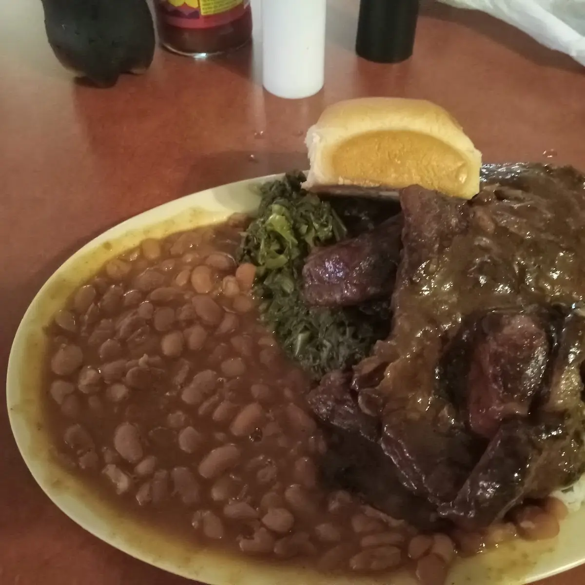 Pork Chops Rice and Gravy Pinto Beans Mixed Greens