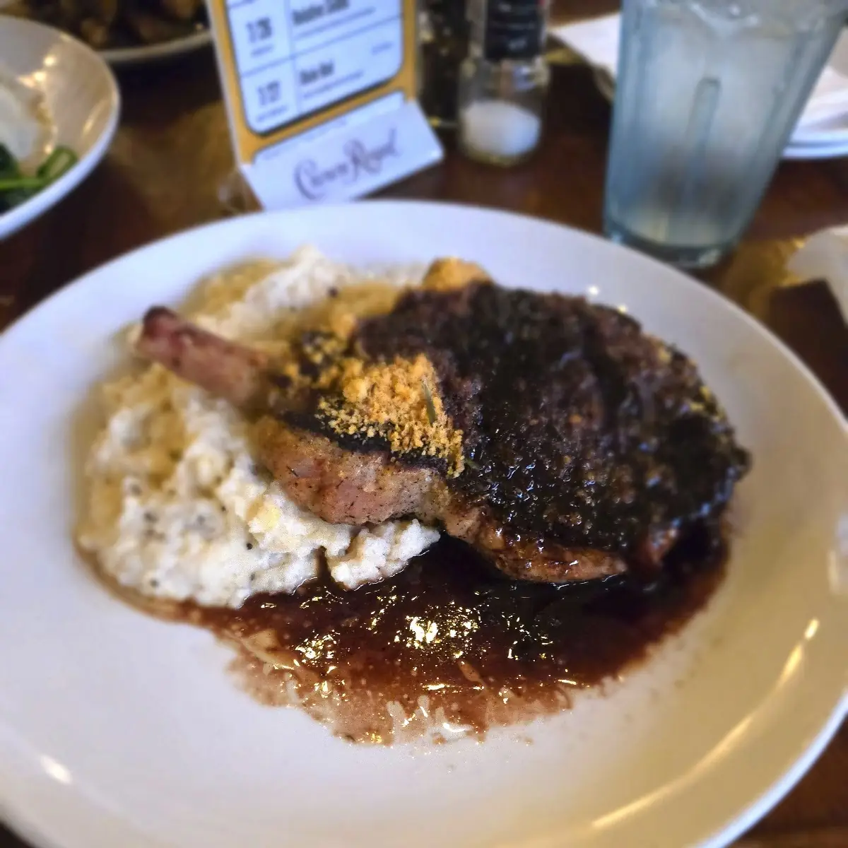 Porkchop and White Cheddar Grits