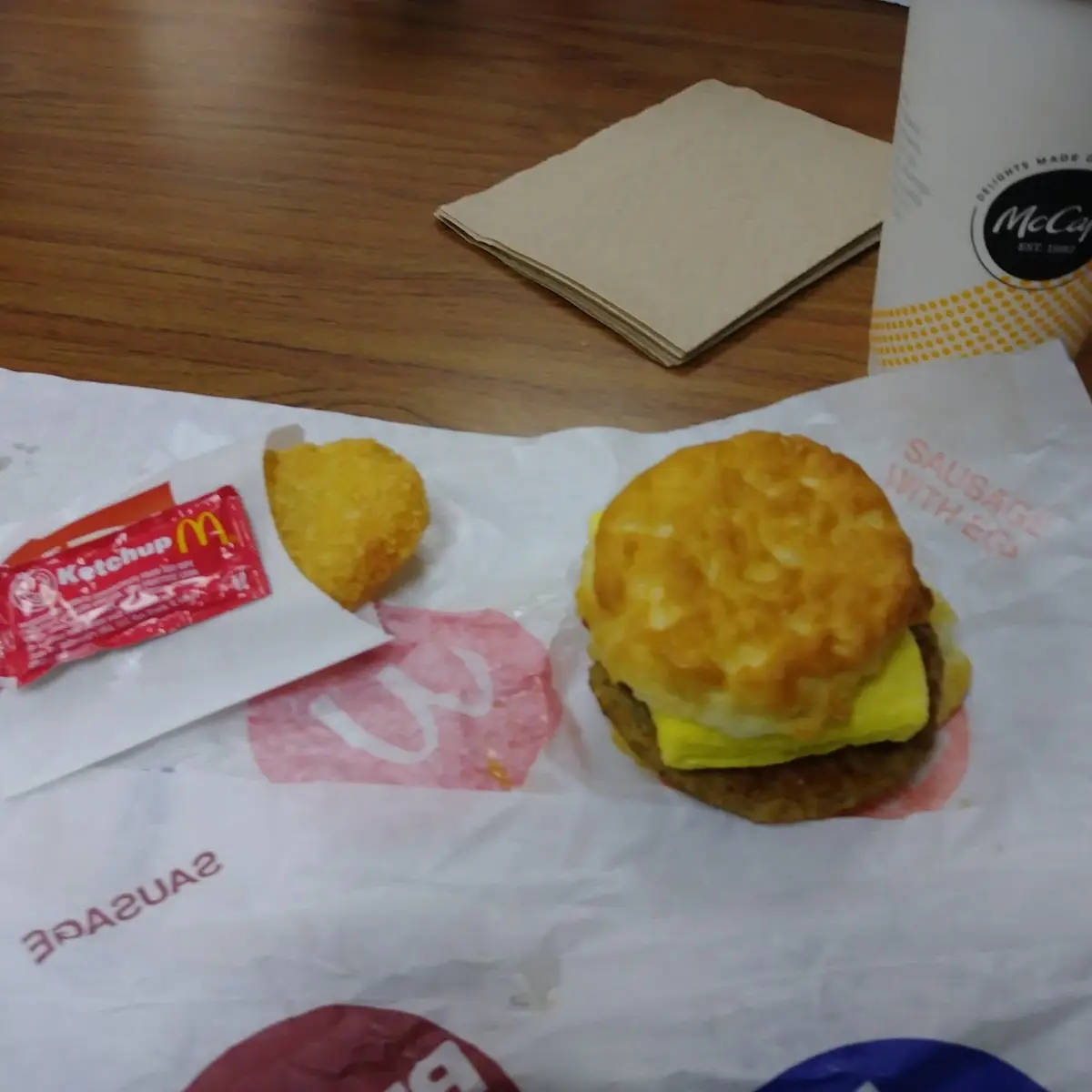 Biscuit with Folded Egg Bacon and Hash Brown