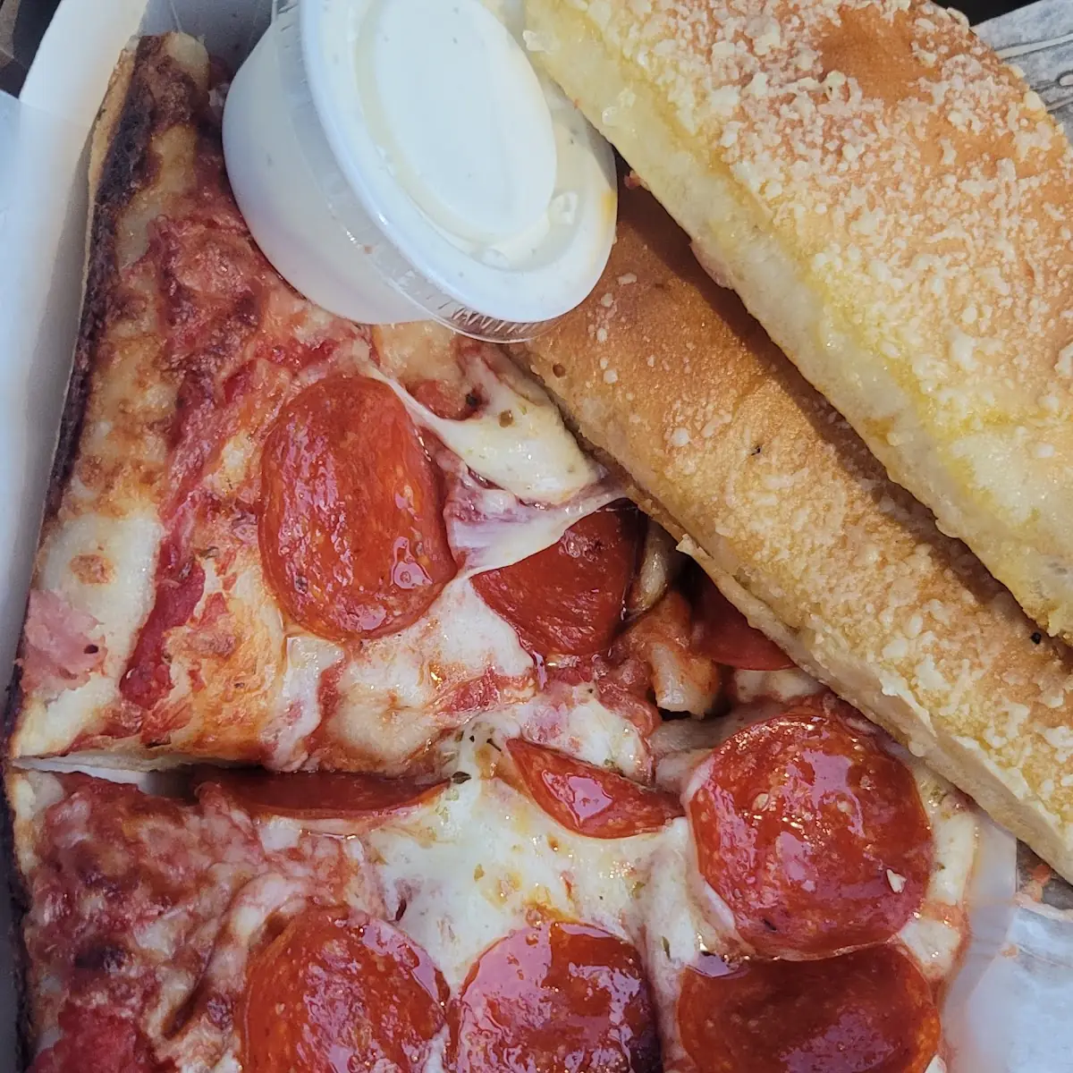 Pepperoni Pizza Slice and Breadsticks