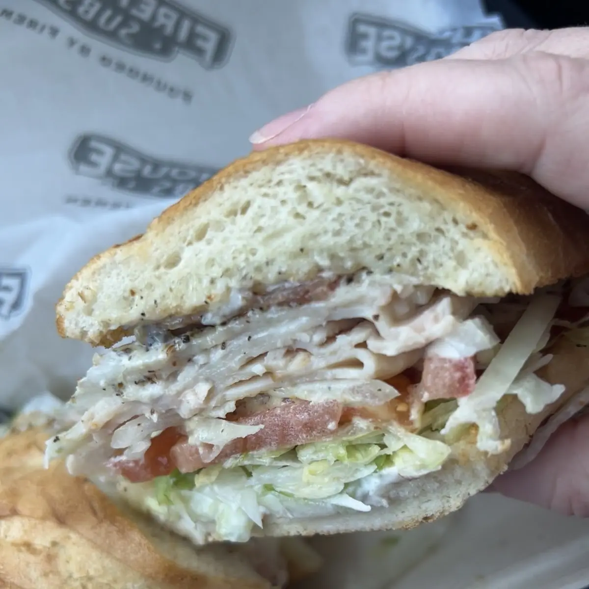 Turkey Provolone Sub with Bacon Cucumbers Herbs and Salt & Pepper