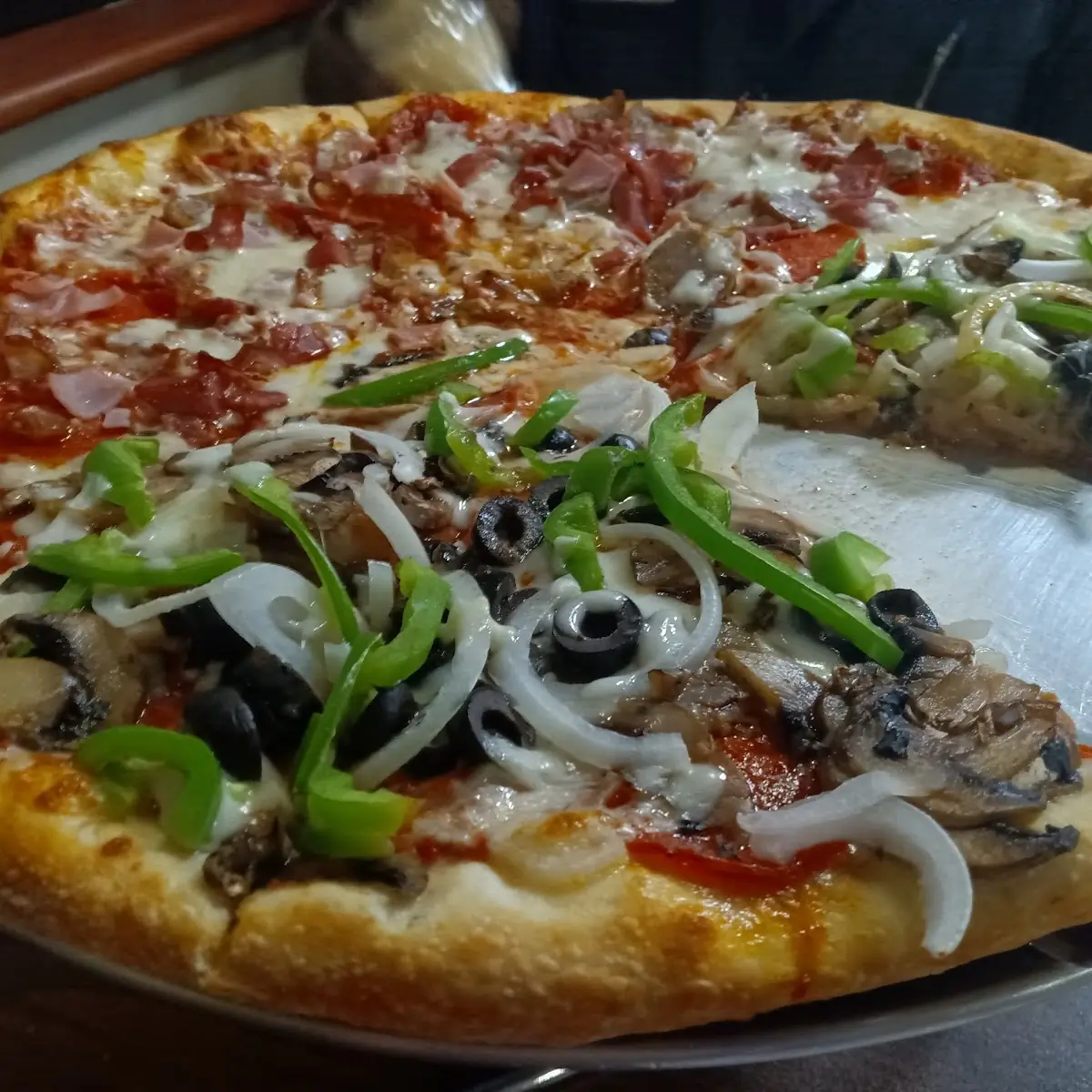 Half Supreme Pizza Half Meat Lovers Pizza
